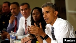 Presiden AS Barack Obama dalam diskusi mengenai penertiban masyarakat dan peradilan kriminal di Gedung Putih (13/7). (Reuters/Kevin Lamarque)