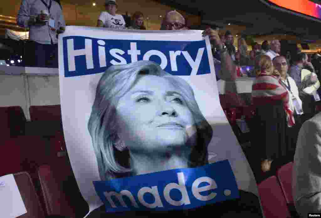 A delegate holds a Hillary Clinton poster at the Democratic National Convention in Philadelphia, Pennsylvania, July 28, 2016.
