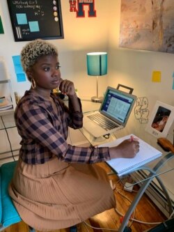 Kasey Woods works from her home in Mount Vernon, New York, April 3, 2020.