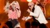 FILE - Pitbull performs his song "Timber" with Ke$ha (L) at the 41st American Music Awards in Los Angeles, California, Nov. 24, 2013. 