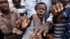 Protesters show bullet casings during a protest against Burundi President Pierre Nkurunziza and his bid for a third term in Bujumbura, Burundi, May 19, 2015. 