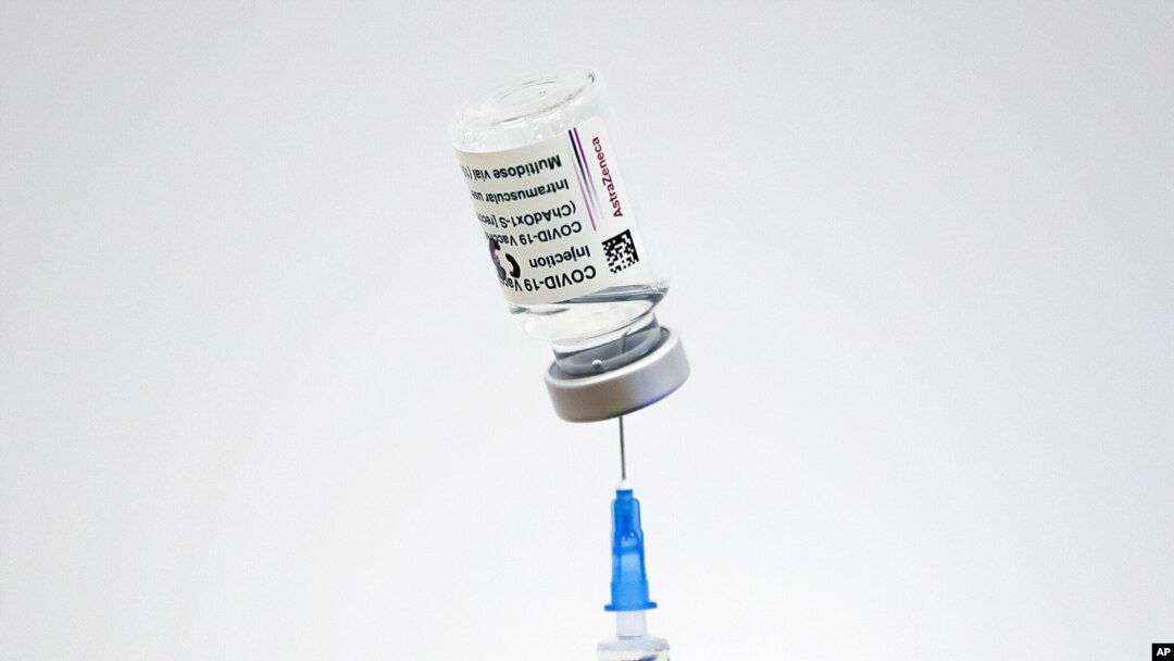 A member of the medical staff draws serum from an AstraZeneca vaccine container at a vaccination center in Bucharest, Romania, Wednesday, April 7, 2021. British authorities recommended Wednesday that the AstraZeneca COVID-19 vaccine not be given to…