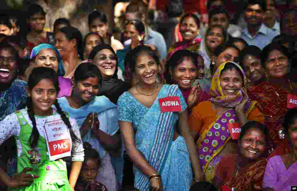 Indian women watch a play about sexual abuse and ways to raise their voice against it on International Women's Day, in New Delhi, India, March 8, 2013.
