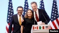 Mexican Economy Minister Ildefonso Guajardo, Canadian Foreign Minister Chrystia Freeland and U.S. Trade Representative Robert Lighthizer smile during a joint news conference on the closing of the seventh round of NAFTA talks in Mexico City, Mexico, March 5, 2018.