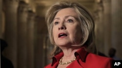 Secretary of State Hillary Clinton following her meeting with Speaker of the House John Boehner, on Capitol Hill in Washington, Monday, Feb. 14, 2011.
