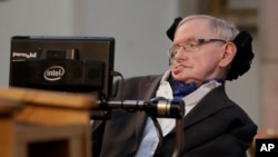 FILE - Cosmologist Stephen Hawking, pictured in London, March 6, 2017, is among the academics, technology experts and rights groups who have warned about the threats posed by artificial intelligence, amid concerns that it might one day control weapons systems.