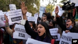 FILE- Activists of various left organizations shout slogans during a protest against hate speech in New Delhi, India, Dec.27, 2021. 