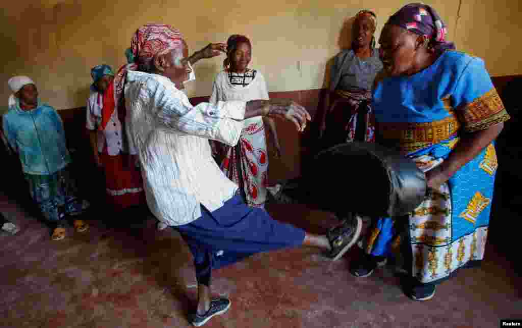 Beatrice Nyariara, 81, trains with Esther Njeri, 82, and members of the Granny Defense "Cucu Jikinge" program that trains elderly women on the basic Karate skills for self-defense, in Nairobi, Kenya.