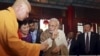 Indian Prime Minister Narendra Modi (C) gestures as he visits the Daxingshan Buddhist temple, in Xian, Shaanxi province, China, May 14, 2015.