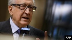 FILE - U.N.-Arab League peace envoy Lakhdar Brahimi gestures during a stakeout following a meeting with top US and Russian officials on the Syrian conflict at the United Nations office in Geneva, January 11, 2013.
