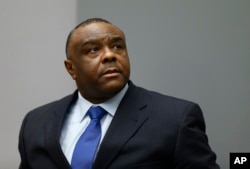 FILE - In this June 21, 2016 photo, former Congolese Vice President Jean-Pierre Bemba enters the courtroom of the International Criminal Court in The Hague, Netherlands.