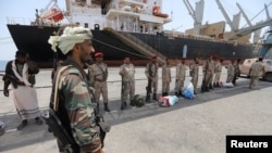 FILE - Yemen's Houthi movement forces are seen during withdrawal from Saleef port in Hodeidah province, May 11, 2019. 