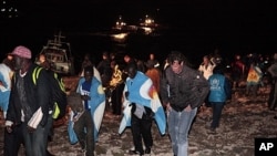 Migrants arrive on the tiny island of Lampedusa, Italy, May 8, 2011