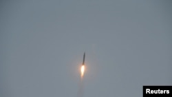 FILE - A tactical rocket lifts off during a firing drill of the KPA Strategic Force in this undated photo released by North Korea's Korean Central News Agency.