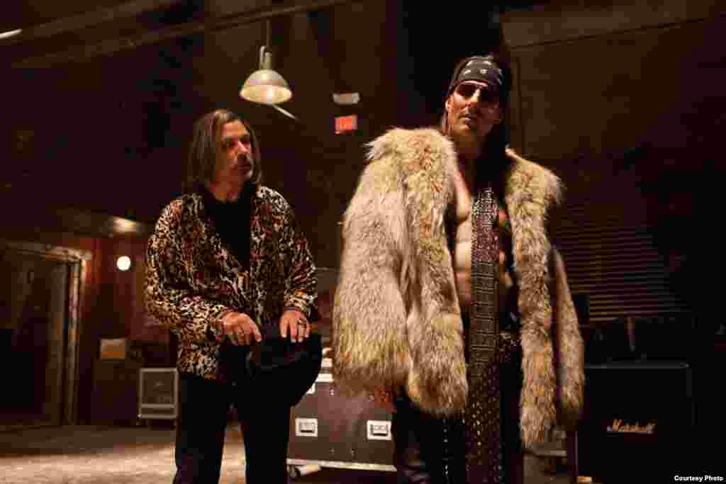 (L-r) ALEC BALDWIN as Dennis Dupree and TOM CRUISE as Stacee Jaxx in New Line Cinema’s rock musical “ROCK OF AGES,” a Warner Bros. Pictures release. (Photo: Warner Bros. / David James)