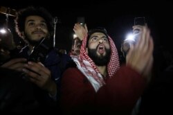Protesters shout slogans during a protest against U.S. President Donald Trump's proposed Middle East peace plan, near the U.S. Embassy in Amman, Jordan, Jan. 28, 2020.