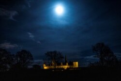 A view of the Kronborg Castle before the lights are switched off for Earth Hour, in Elsinore, Denmark, March 27, 2021.