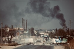 FILE - A checkpoint, abandoned by Syrian Democratic Forces after Turkish military operations began, pictured on Oct. 11, 2019, outside Ras al-Ayn, Syria. (A. Lourie/VOA)