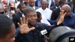 Joao Lourenco, shows his ink-stained finger after casting his vote in elections in Luanda, Angola on August 23, 2017. (AP Photo/Bruno Fonseca, File)