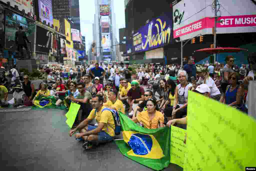 Demonstrators attend a protest against Brazil's President Dilma Rousseff in Times Square, New York, Aug. 16, 2015.