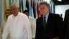 Philippine Foreign Affairs Secretary Albert Del Rosario (L) walks with U.S. Representative Chris Smith upon arrival at the Department of Foreign Affairs headquarters in Pasay city, metro Manila, Nov. 25, 2013. 