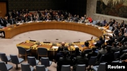 FILE - Members of the U.N. Security Council vote on a U.S. draft resolution calling for free and fair presidential elections in Venezuela at U.N. headquarters in New York, Feb. 28, 2019. 