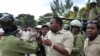 FILE - This photo taken on Jan. 5, 2011 shows Godbless Lema, a member of parliament for Arusha town, being arrested by an anti-riot police during a peaceful demonstration by supporters of the main opposition party Chadema. 