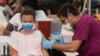 US COVID-19 Cases Hit Six-Month High at Over 100,000