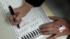 A voter, who did not wish to be identified, votes on Election Day at the Holland Land Office Museum in Batavia, N.Y., Tuesday, Nov. 6, 2012.