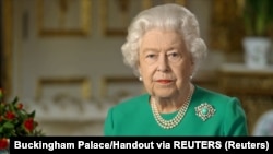 United Kingdom, London, Buckingham Palace handout image of Britain's Queen Elizabeth during her address to the nation and the Commonwealth in relation to the coronavirus epidemic