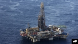 In this photo provided by the Cyprus Press and Information Office, the Noble Energy company's offshore oil and gas rig is seen some 185 kilometers off Cyprus' south coast, Monday, Nov. 21, 2011.
