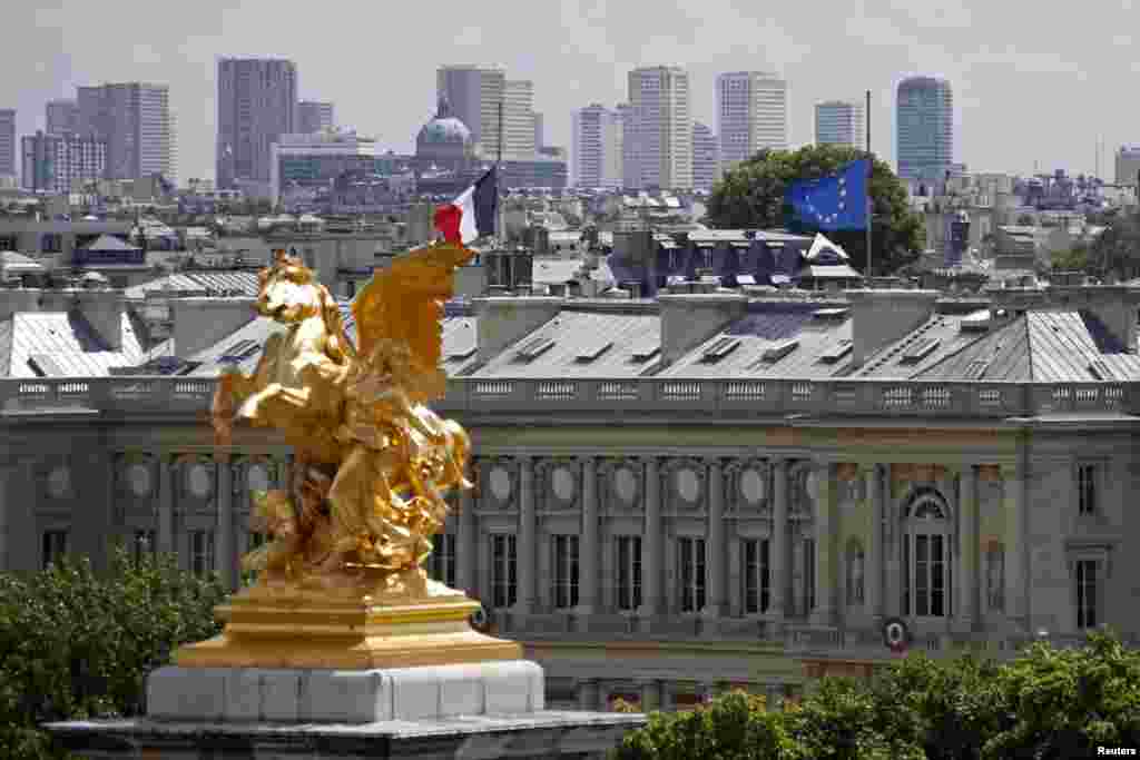 French and European flags fly at half-staff, Quai d'Orsay, in Paris, July 28, 2014.