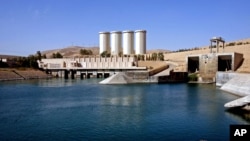 FILE - A general view of the dam in Mosul, 360 kilometers (225 miles) northwest of Baghdad, Iraq. Italian engineers hired to work on the dam say they will need at least 2 months to assess the structure before starting work.