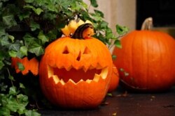 A jack-o'-lantern is part of a Halloween display in front of an Upper East Side home on Oct. 30, 2020, in New York City.
