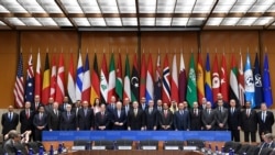 Secretary of Sate Mike Pompeo, center, and other foreign ministers and foreign officials pose for a photo at the State Department in Washington, Nov. 14, 2019, for the Global Coalition to Defeat ISIS Small Group Ministerial meeting.
