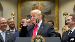 President Donald Trump says "Did I hear the word bipartisan?" as he announces his support for H.R. 5682, the "First Step Act" as bipartisan legislation during a speech in in Washington, Nov. 14, 2018, which would reform America's prison system.