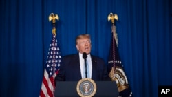 FILE - President Donald Trump delivers remarks on Iran, at his Mar-a-Lago property in Palm Beach, Fla., Jan. 3, 2020.