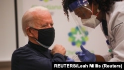 USA, Newark, Delaware, U.S. President-elect Joe Biden receives a dose of a vaccine against the coronavirus disease