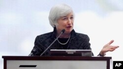 FILE - Federal Reserve Chairman Janet Yellen speaks during a conference on economic opportunity at the Federal Reserve Bank in Boston, Oct. 17, 2014.