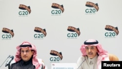 Saudi Minister of Finance Mohammed al-Jadaan, right, speaks during a media conference with central bank governor Ahmed al-Kholifey, in Riyadh, Saudi Arabia, Feb. 23, 2020.