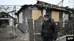 Borys Trymbytsky, 62, stands in front of his house damaged following a Russian airstrike in the town of Bilytske, near Pokrovsk in the Donetsk region on January 16, 2025, amid the Russian invasion of Ukraine.