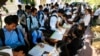 Students register to participate in a campaign by the National Election Committee, NEC, in Phnom Penh, Cambodia, Wednesday, May 9, 2018. NEC on Wednesday held its campaign with the teachers and students on the disseminate awareness of the law on the organization and functioning of the election law for the 2018 general election. (AP Photo/Heng Sinith)
