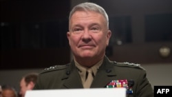 FILE - Then-Lt. Gen. Kenneth F. McKenzie, the nominee to be general and commander of U.S. Central Command, testifies during a Senate Armed Services Committee confirmation hearing on Capitol Hill in Washington, Dec. 4, 2018.