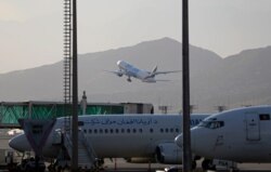 FILE - A plane takes off from Hamid Karzai International Airport in Kabul, Afghanistan, July 4, 2021.