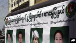 Members of the Union Solidarity and Development Party drive a campaign vehicle with posters of the party's candidates before elections (File Photo)