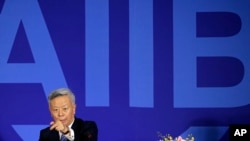 Head of the Asian Infrastructure Investment Bank Jin Liqun speaks to reporters in Beijing. China is the top shareholder in the development bank which has lent $1.7 billion in a little more than one year.