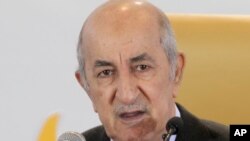 FILE - Newly elected Algerian President Abdelmadjid Tebboune speaks during a press conference, Dec.13, 2019, in Algiers. 
