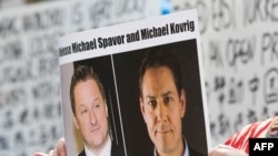 Les Canadiens Michael Spavor (à g.) et Michael Kovrig sur cette photo d'archive prise le 8 mai 2019.