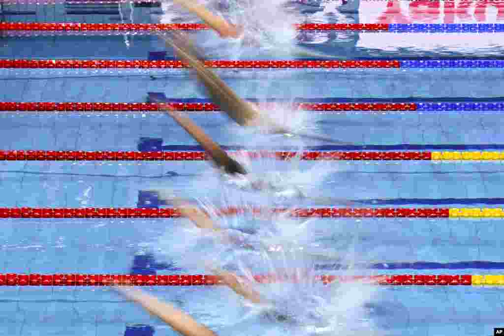 Athletes compete in the Men's 200m Butterfly Heats on day three of the World Short Course Swimming Championships in Budapest, Hungary.
