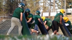 Many football players, displaced since the fire, commute from other towns and cities to school daily. (Elizabeth Lee/VOA News)